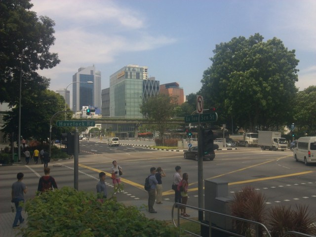 Pedestrians are waiting the green sign