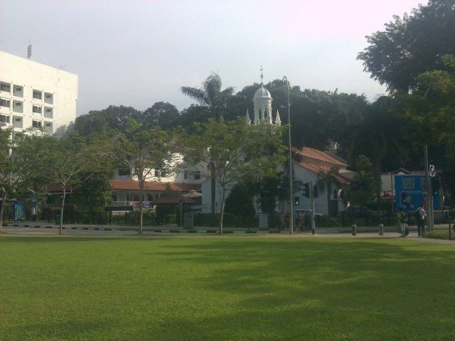 A field and a church approaching Orchard Road