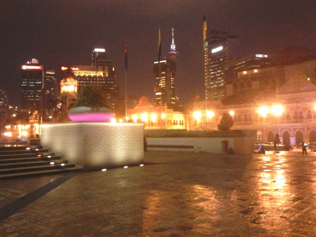 Dataran Merdeka and the skyscrapers of Kuala Lumpur at the background