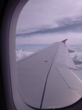 Samudera awan dari balik jendela Air Asia