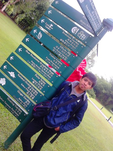 With jacket, black stretch pants, and a 60L carrier at Singapore Botanic Gardens