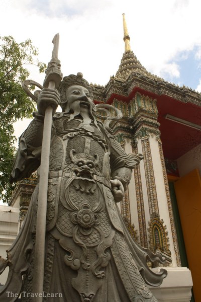 Statue of Buddhist god at the entrance gate