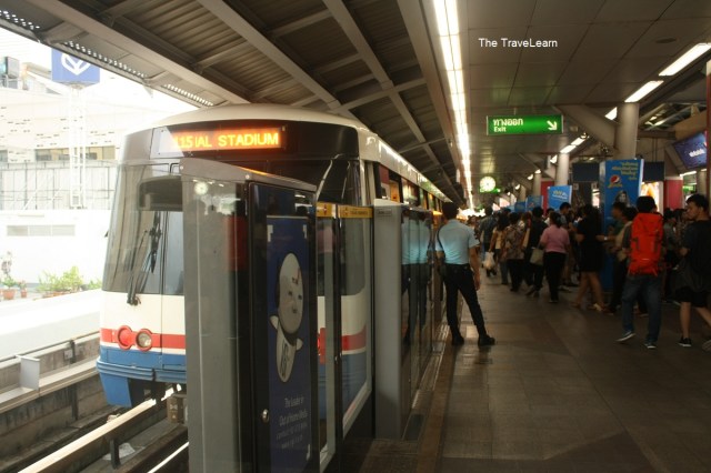 Platform area at Saphan Taksin station with a security officer