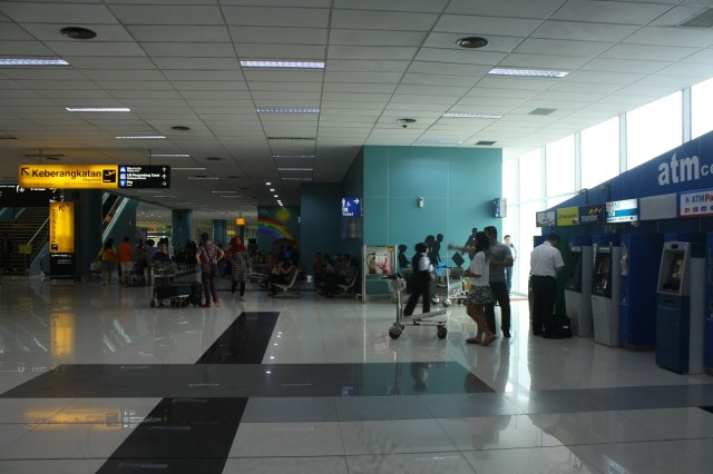Toilet and ATM Center on the right of Information Center. There are ATMs too on second floor.