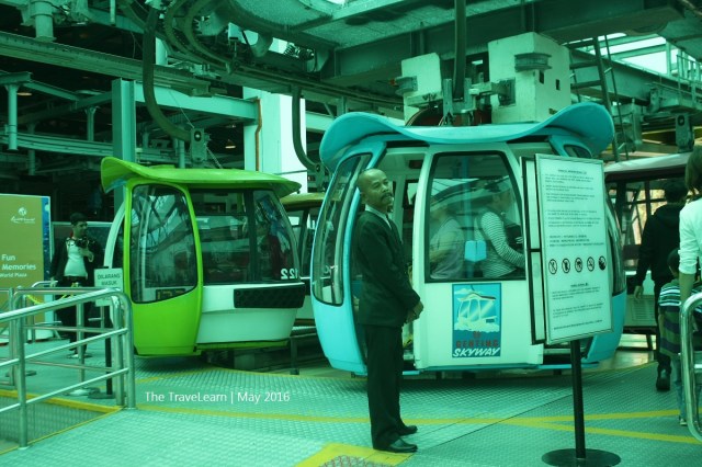 Officer standing next to Genting Skyway Cable Car