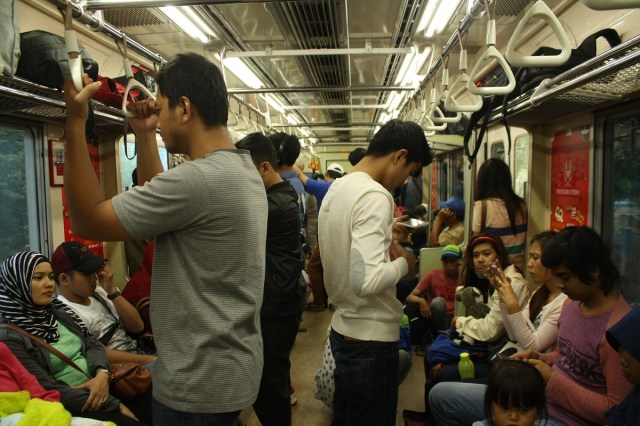 Jakartans inside the coaches